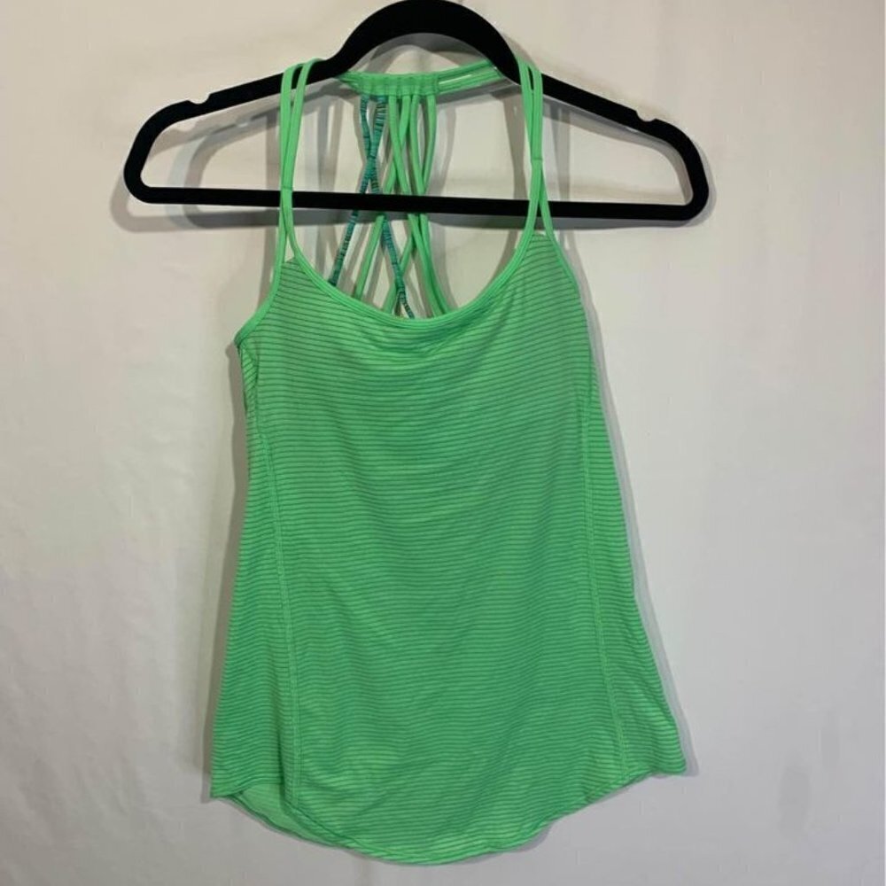 LULULEMON woman’s tank top with built in sports bra. Size 4. New condition.